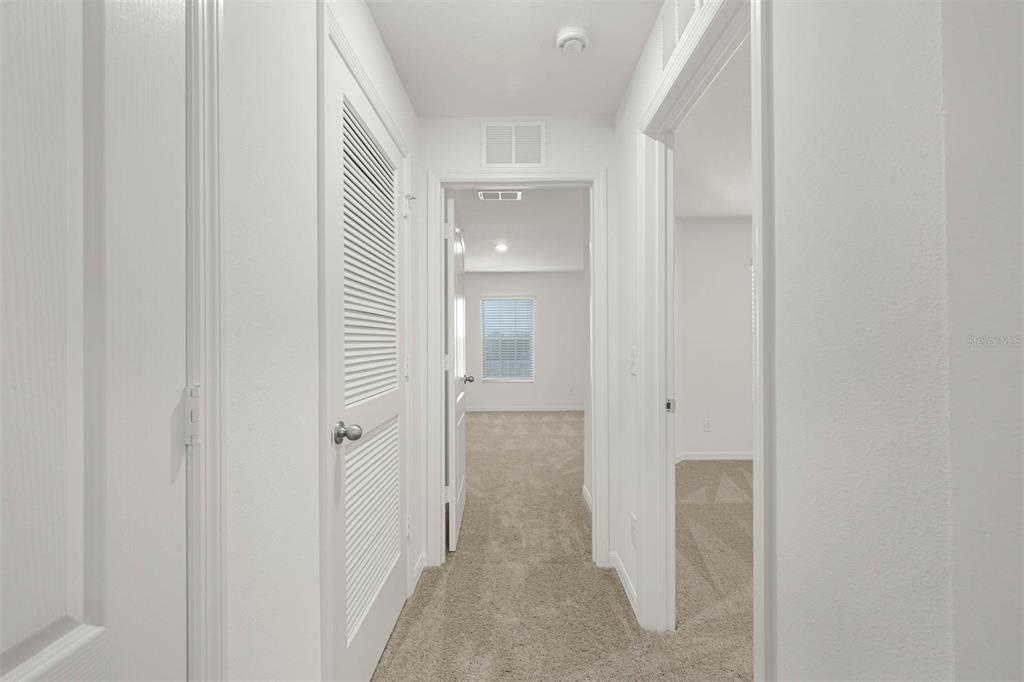 721 Poppy Lane Dundee, FL 33838 - Photo 16 of 26 a view of a bathroom from a hallway