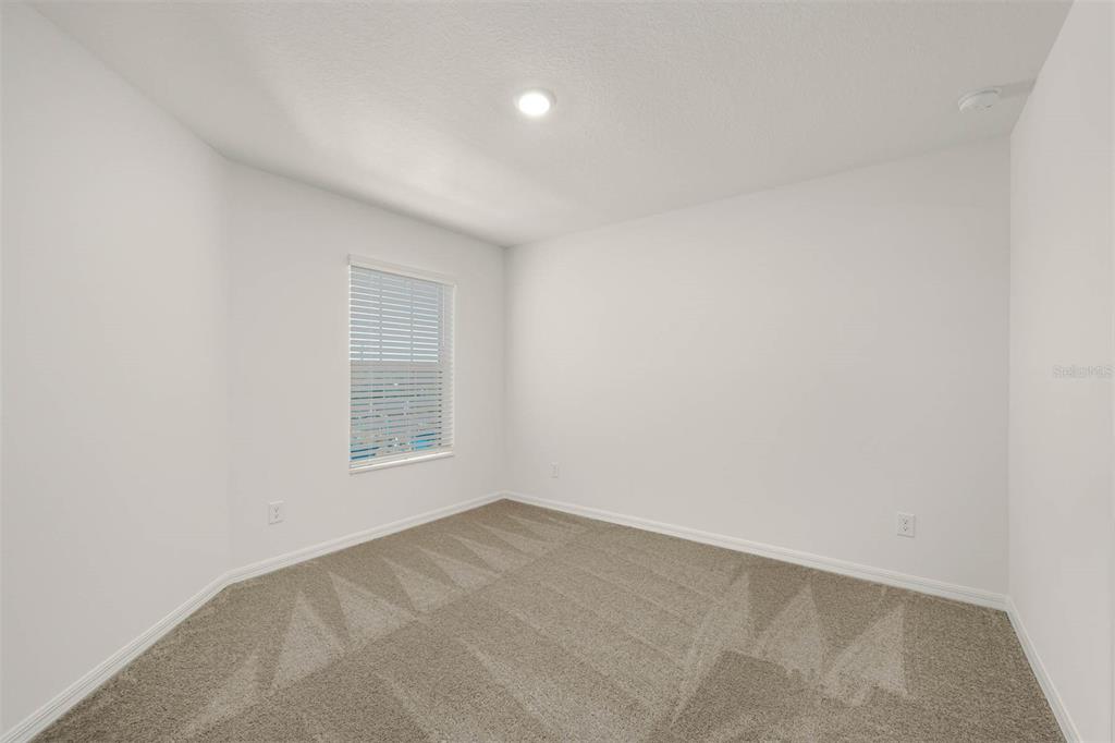 721 Poppy Lane Dundee, FL 33838 - Photo 22 of 26 a view of an empty room and a window