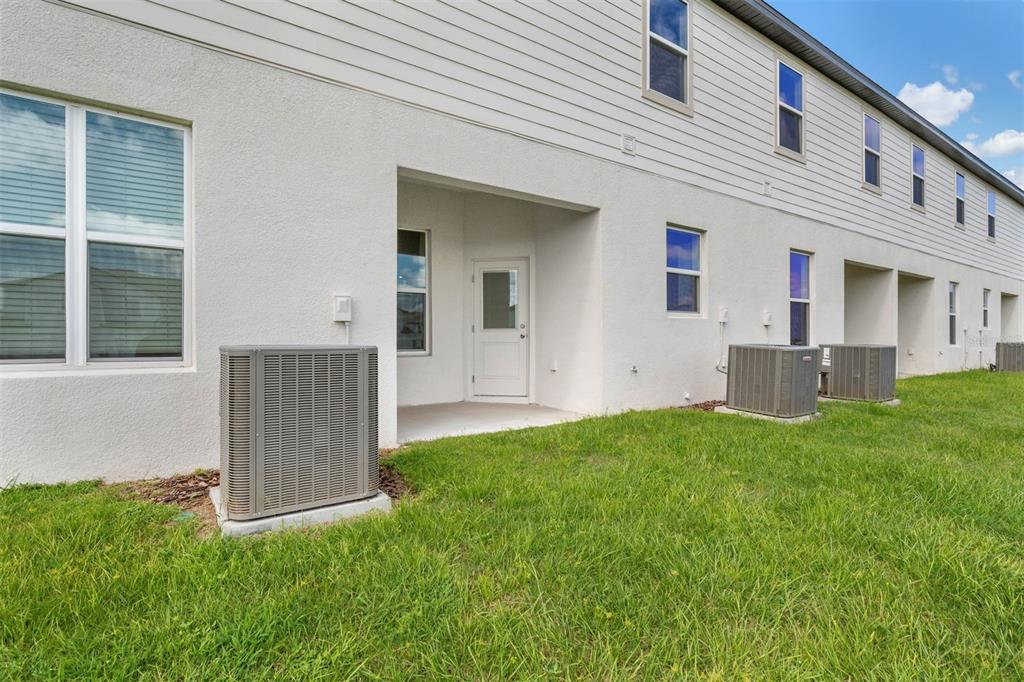 721 Poppy Lane Dundee, FL 33838 - Photo 26 of 26 a view of backyard with a garden and plants