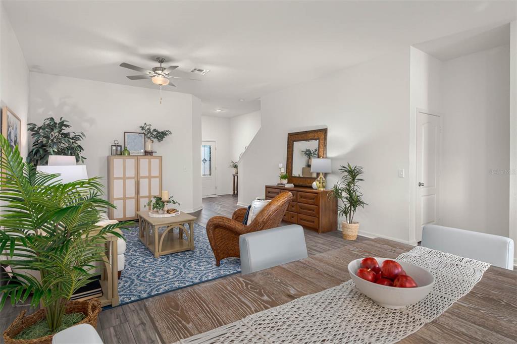 721 Poppy Lane Dundee, FL 33838 - Photo 7 of 26 a living room with furniture and a potted plant