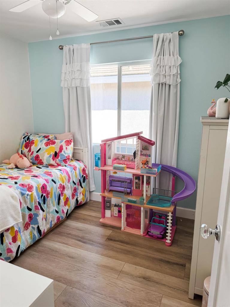 1461 Fieldbrook Street Chula Vista, CA 91913 - Photo 12 of 12 a bedroom with a bed and a window