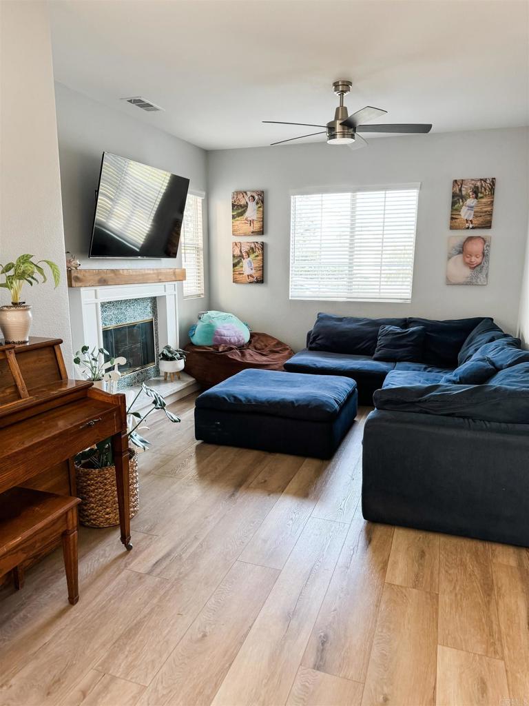 1461 Fieldbrook Street Chula Vista, CA 91913 - Photo 2 of 12 a living room with furniture fireplace and a window