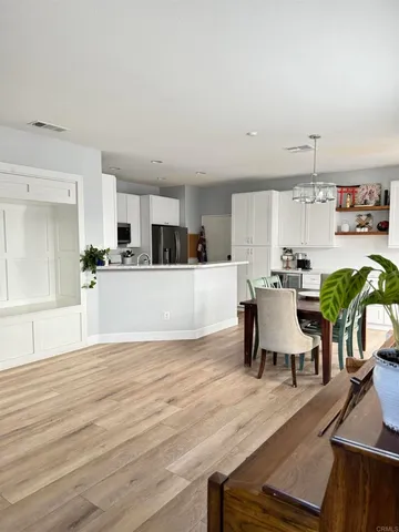 a kitchen with a table and chairs in it