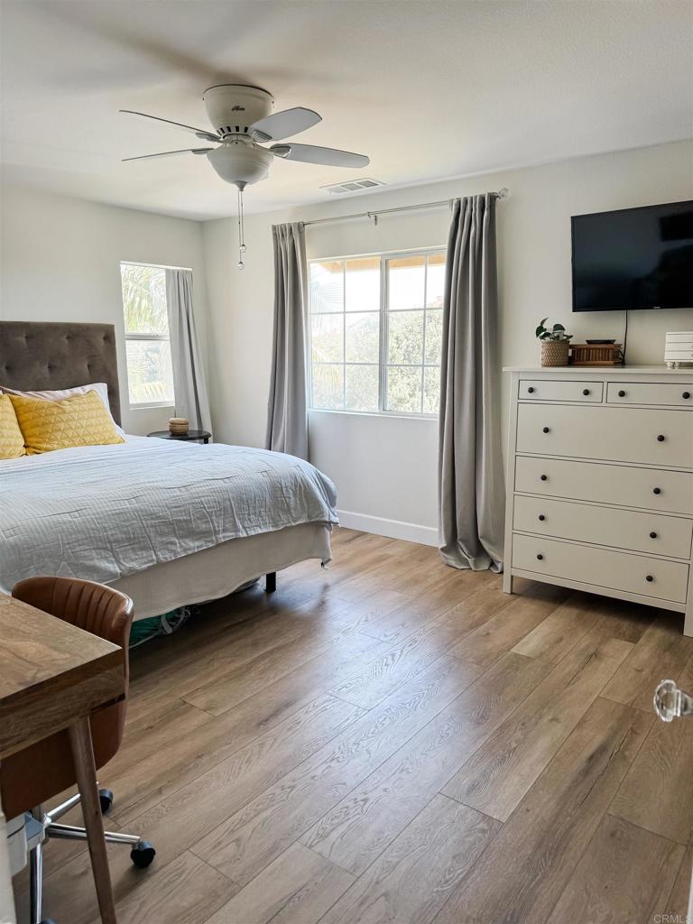 1461 Fieldbrook Street Chula Vista, CA 91913 - Photo 6 of 12 a bedroom with a bed and a flat screen tv