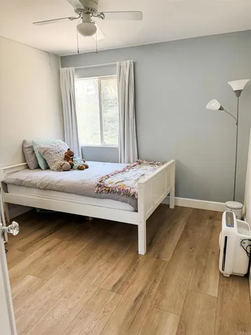 a bedroom with a bed and window