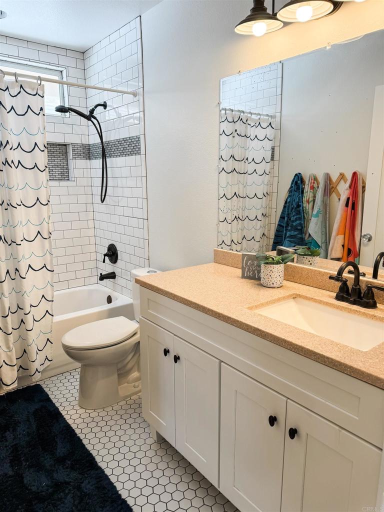 1461 Fieldbrook Street Chula Vista, CA 91913 - Photo 10 of 12 a bathroom with a sink toilet and shower