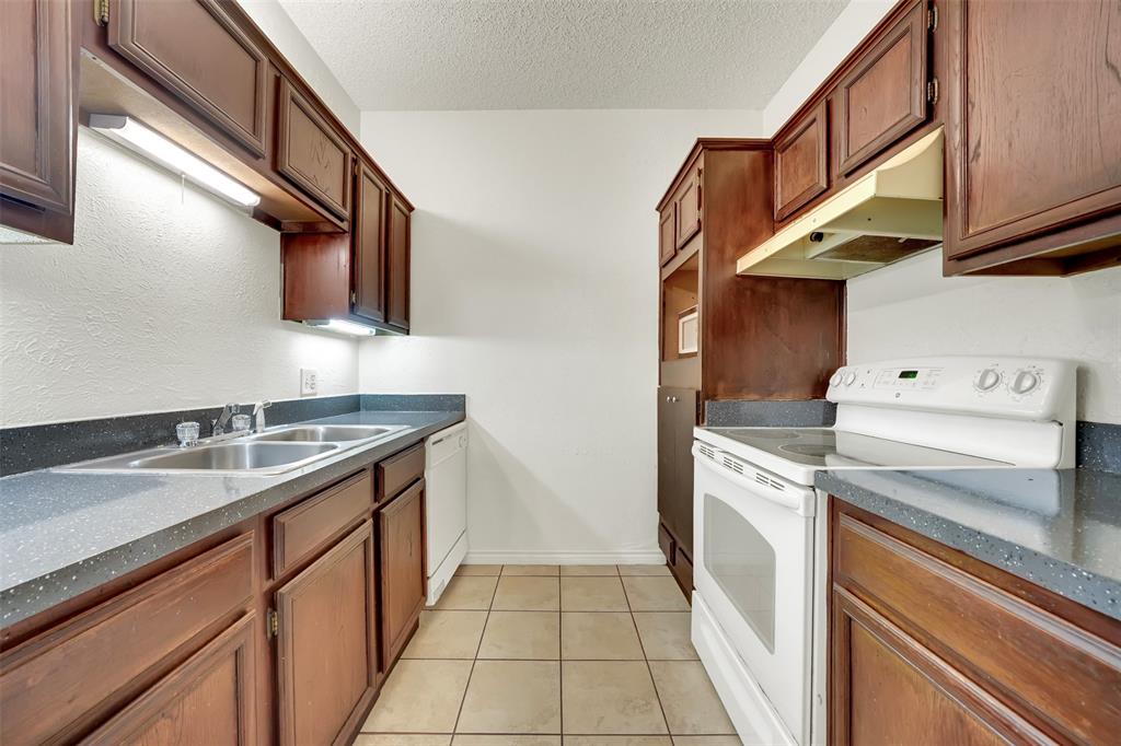 9254 Forest Lane, Unit 407 Dallas, TX 75243 - Photo 7 of 15 a utility room with dryer and washer