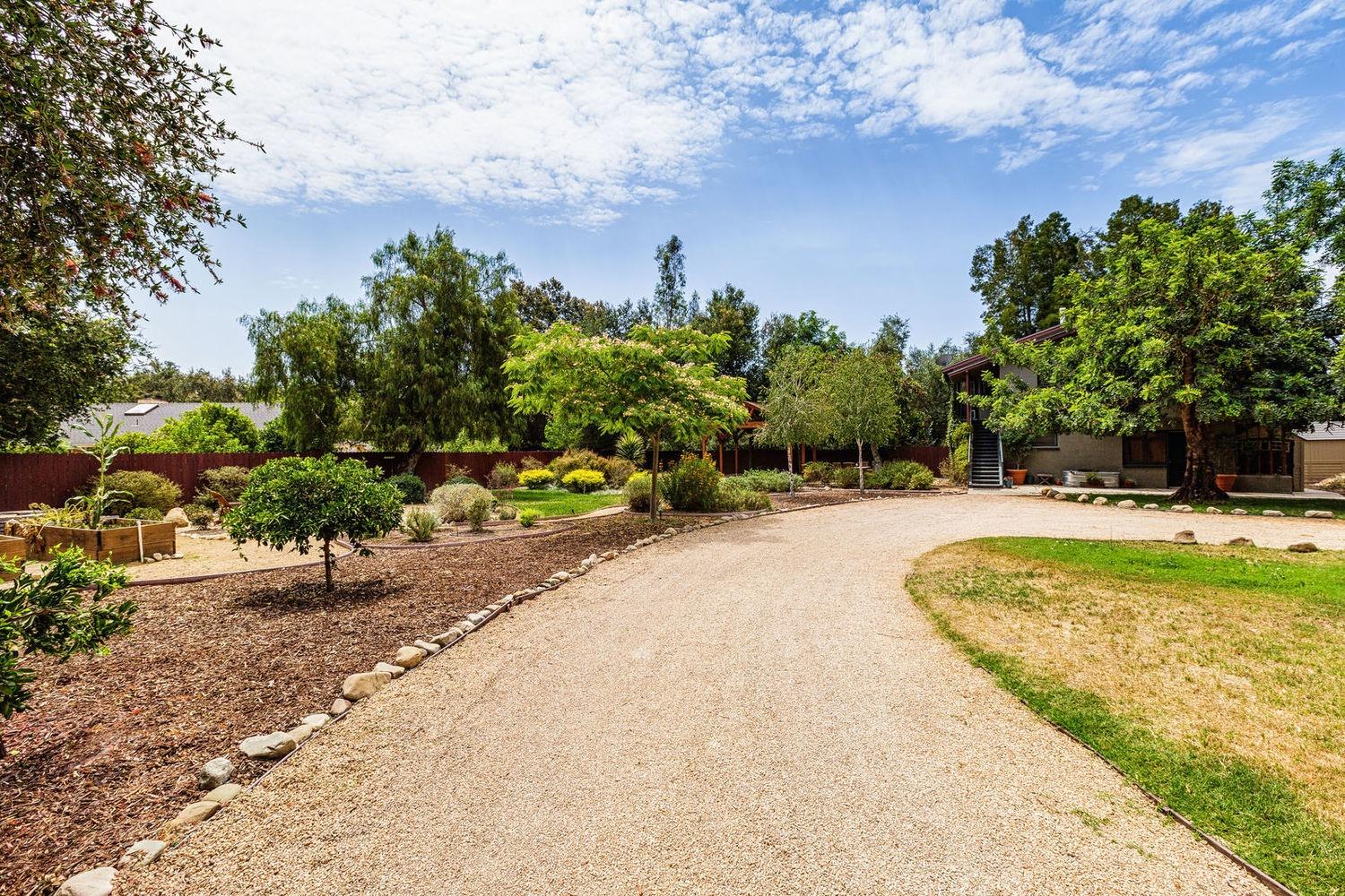 902 Daly Road Ojai, CA 93023 - Photo 3 of 13 a view of a swimming pool with an outdoor seating and a yard