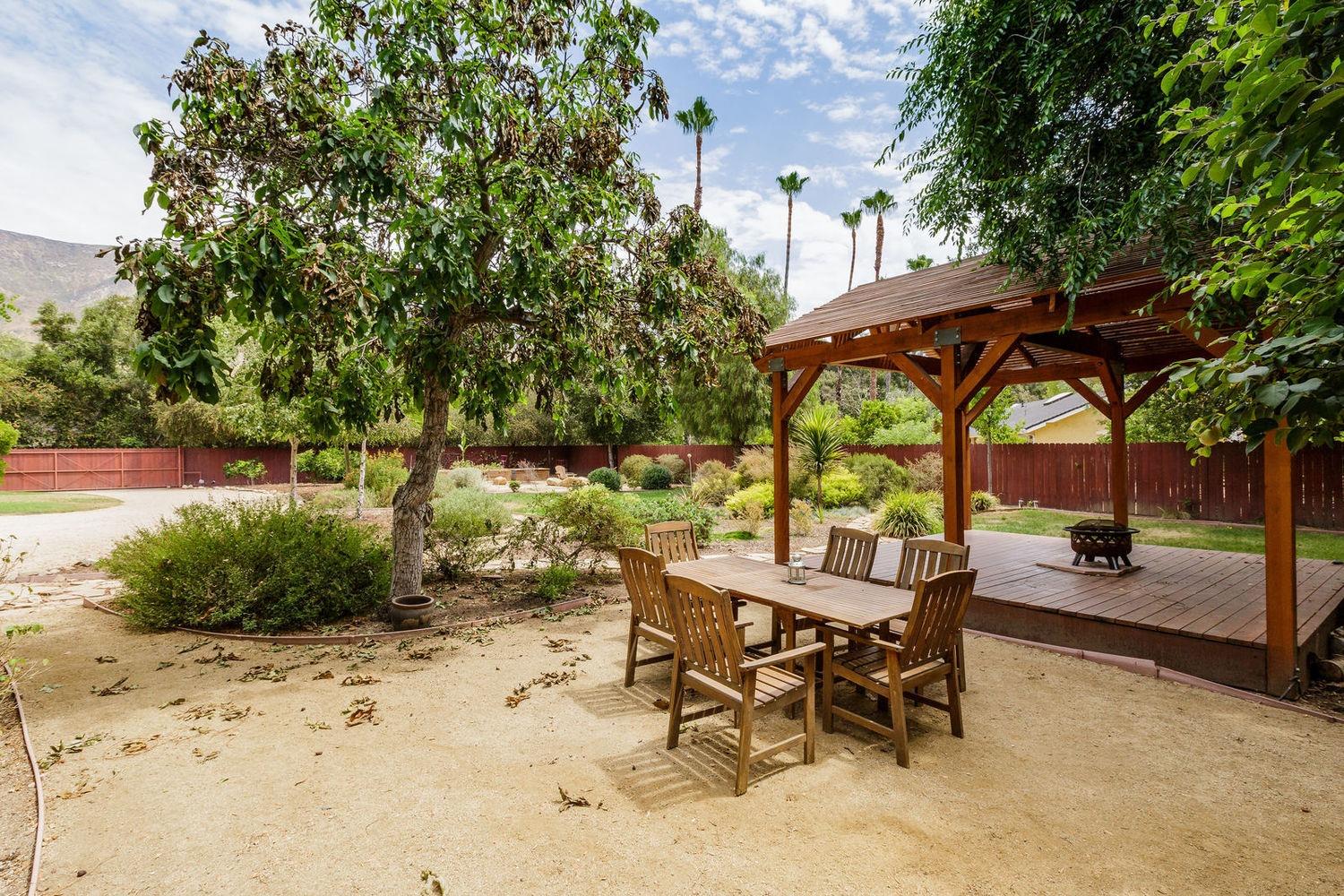 902 Daly Road Ojai, CA 93023 - Photo 8 of 13 an outdoor space with furniture and umbrella