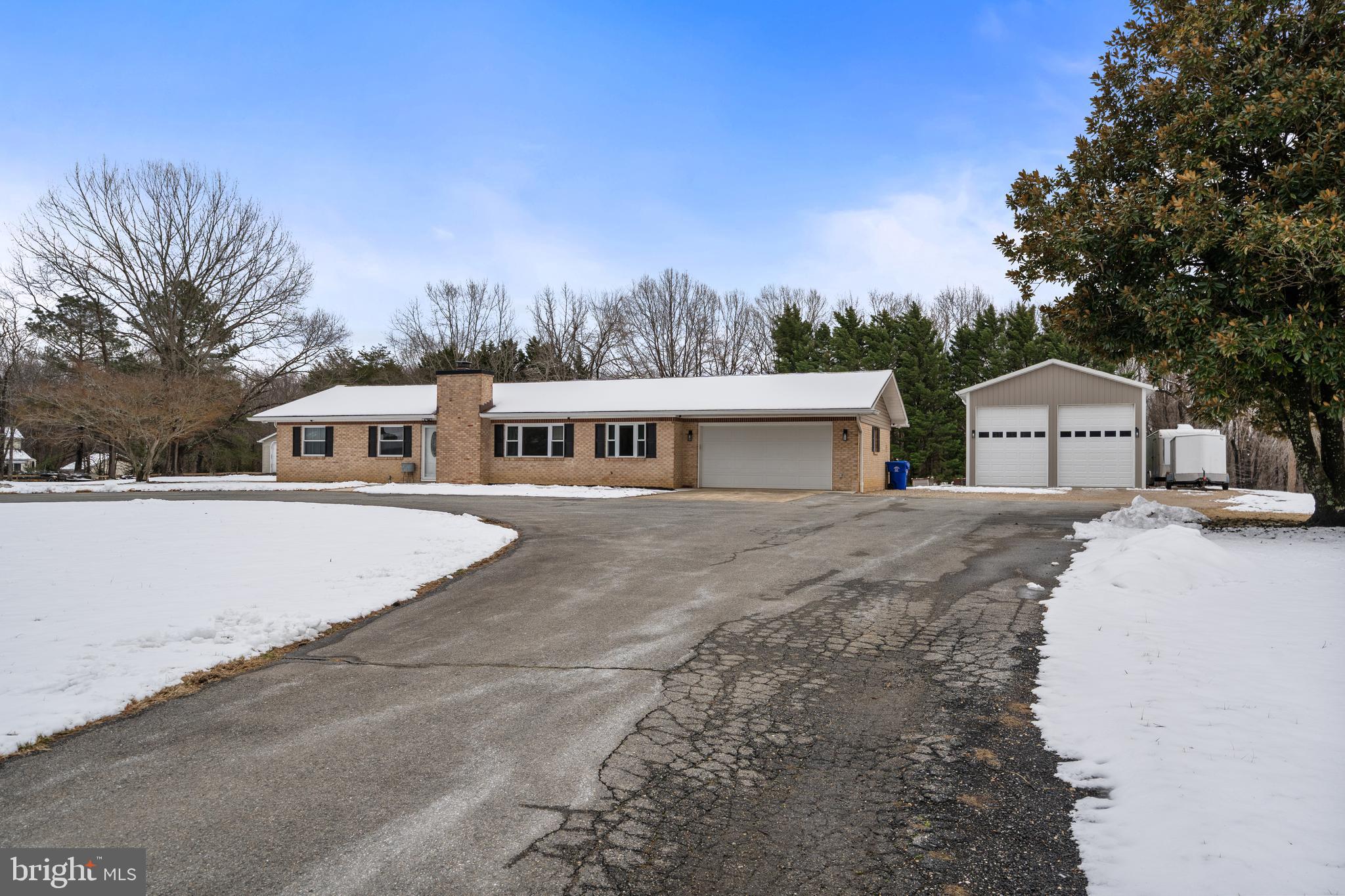 4030 Ravine Drive White Plains, MD 20695 - Photo 15 of 64 a front view of a house with a garden