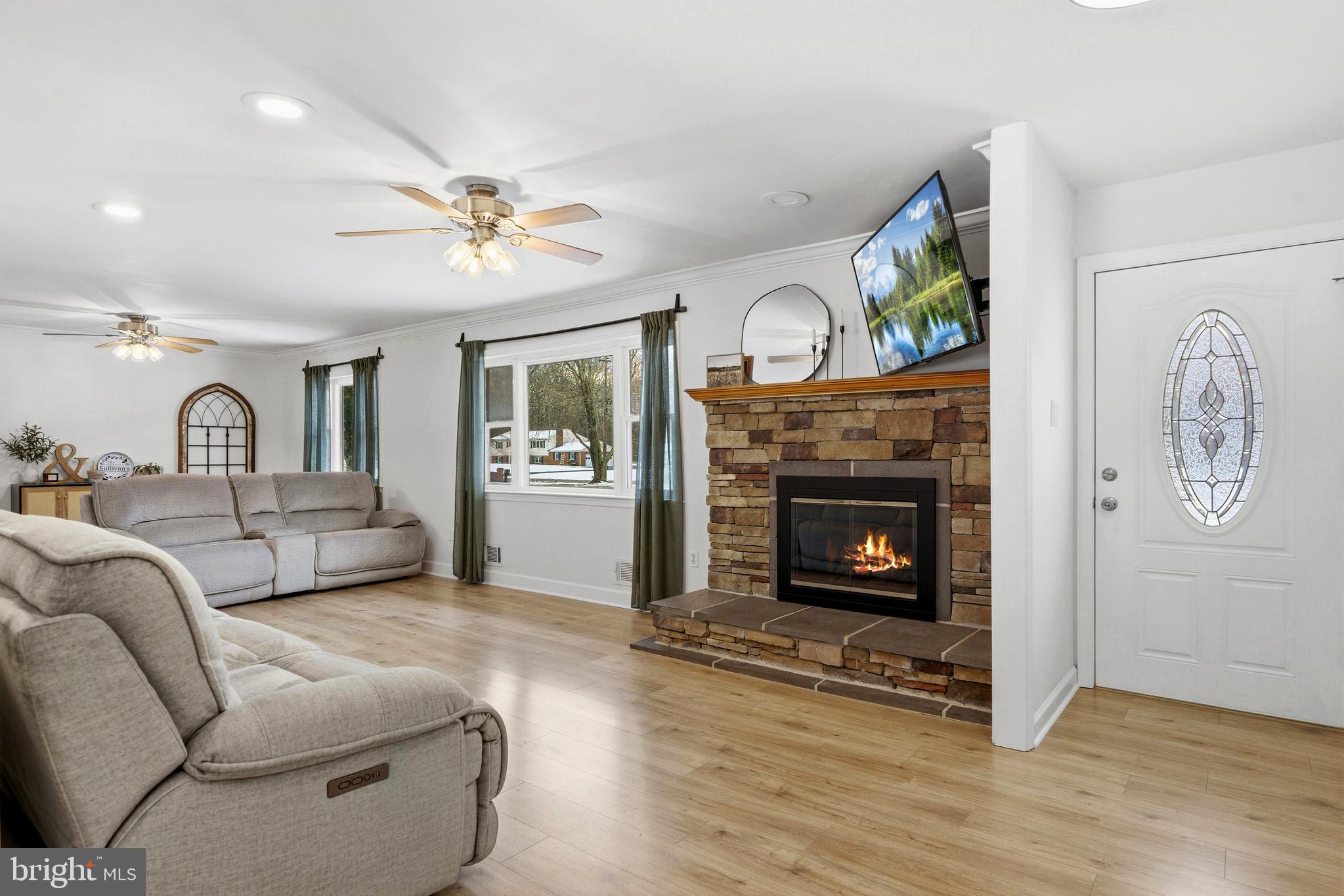 4030 Ravine Drive White Plains, MD 20695 - Photo 19 of 64 a living room with furniture and a fireplace