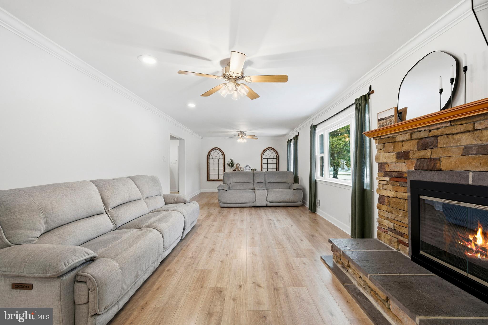 4030 Ravine Drive White Plains, MD 20695 - Photo 20 of 64 a living room with furniture and a fireplace