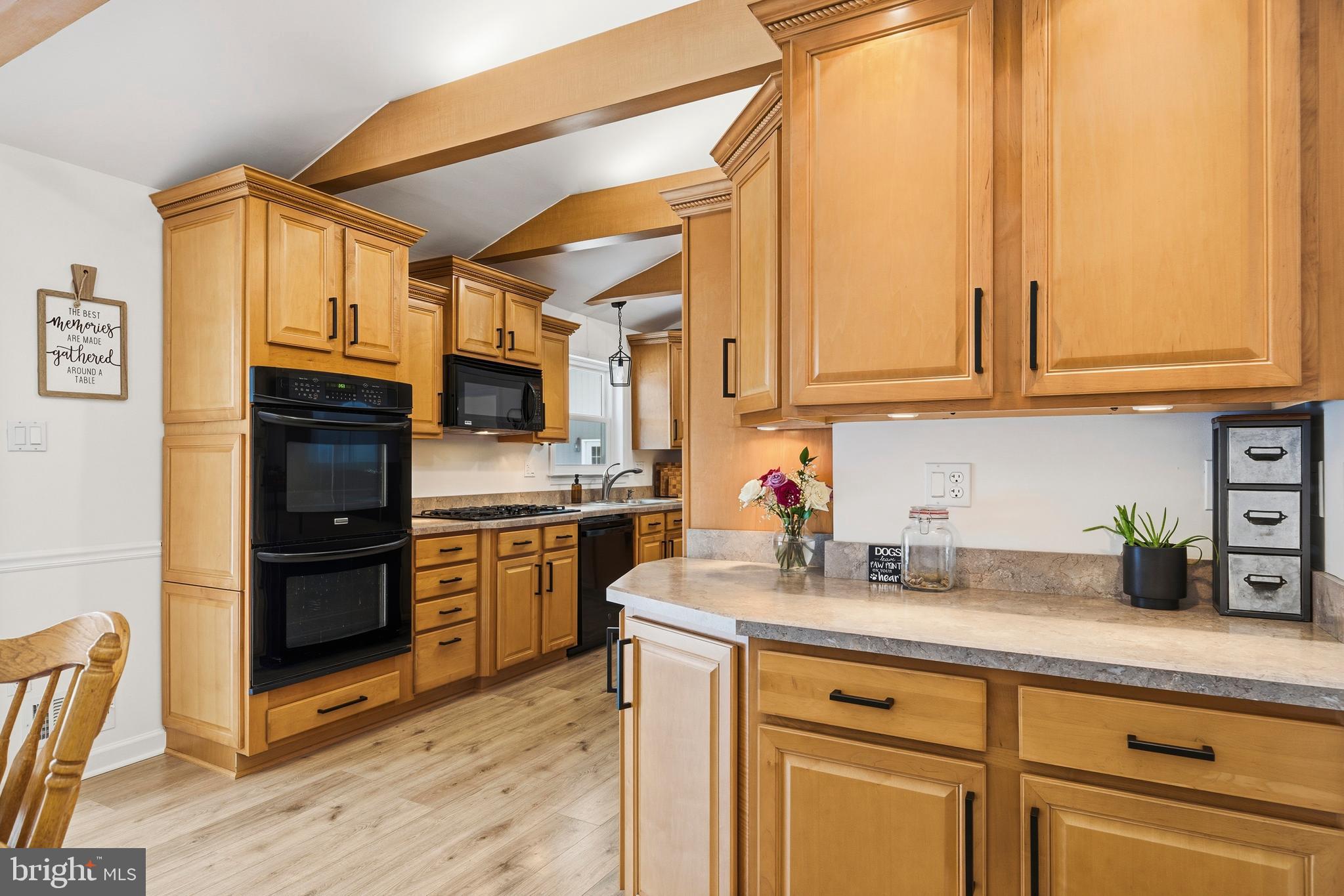 4030 Ravine Drive White Plains, MD 20695 - Photo 23 of 64 a kitchen with stainless steel appliances granite countertop a stove a sink and a refrigerator
