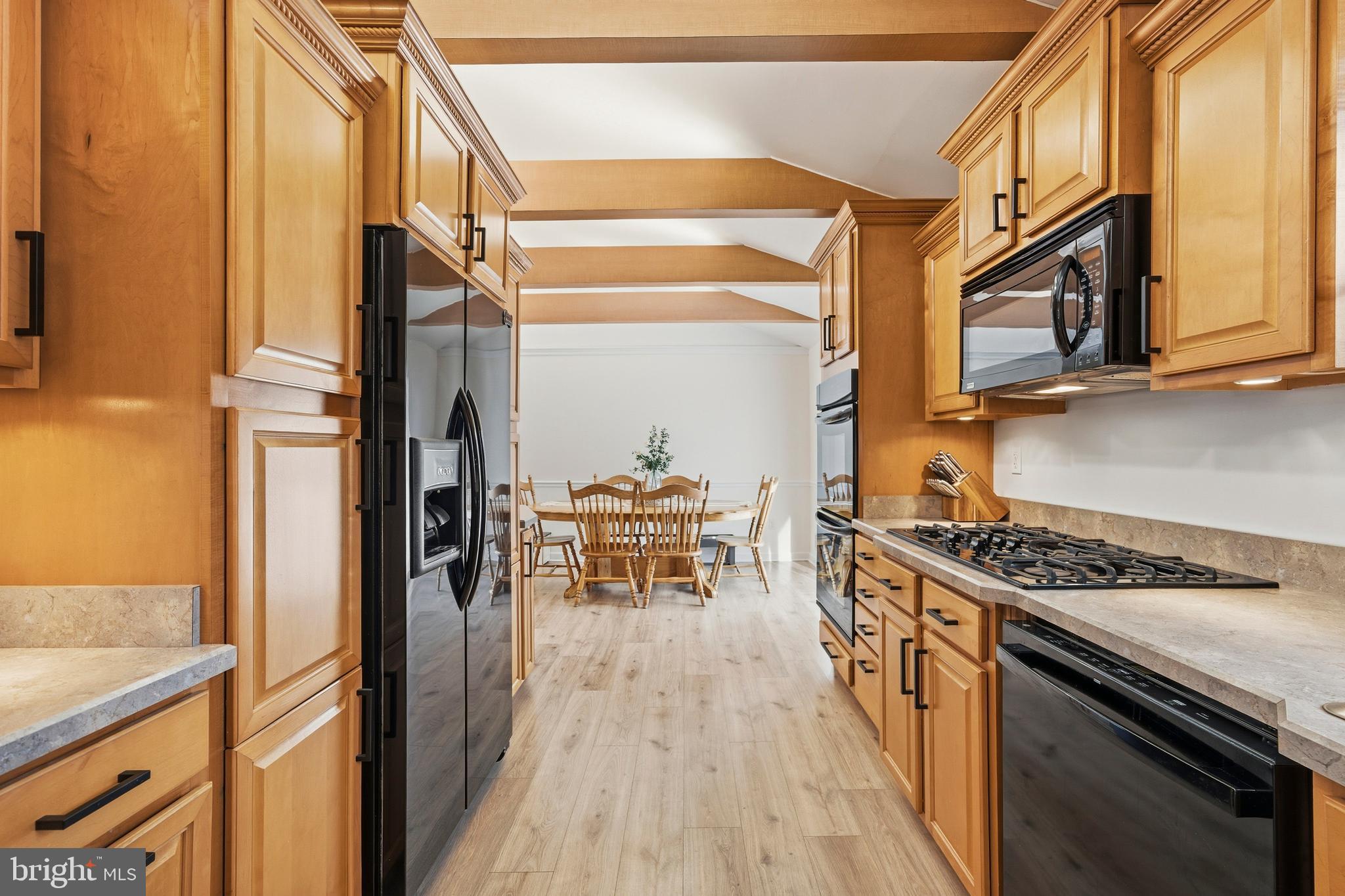4030 Ravine Drive White Plains, MD 20695 - Photo 25 of 64 a kitchen with stainless steel appliances granite countertop a stove and a refrigerator
