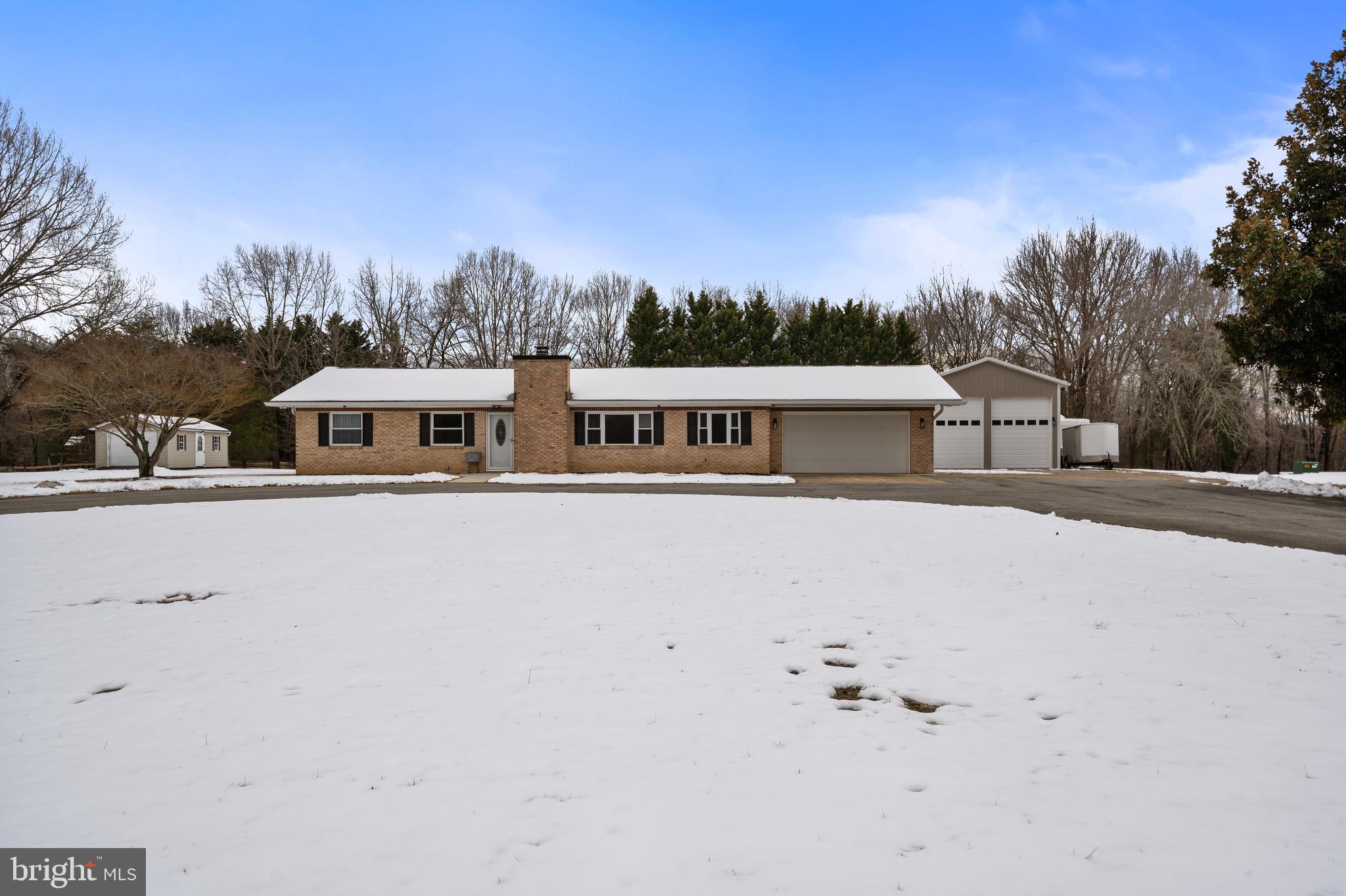 4030 Ravine Drive White Plains, MD 20695 - Photo 3 of 64 a front view of a house with a yard