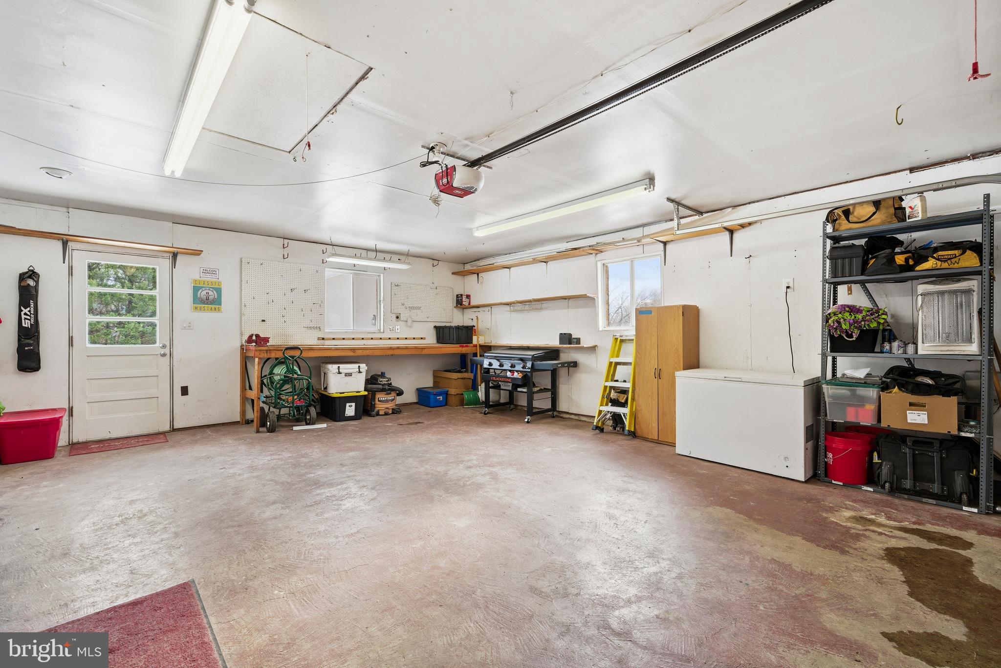 4030 Ravine Drive White Plains, MD 20695 - Photo 32 of 64 a view of a garage with furniture and storage