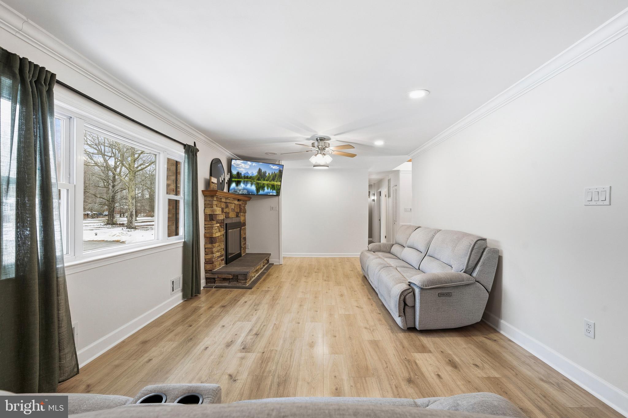 4030 Ravine Drive White Plains, MD 20695 - Photo 38 of 64 a living room with furniture and a wooden floor