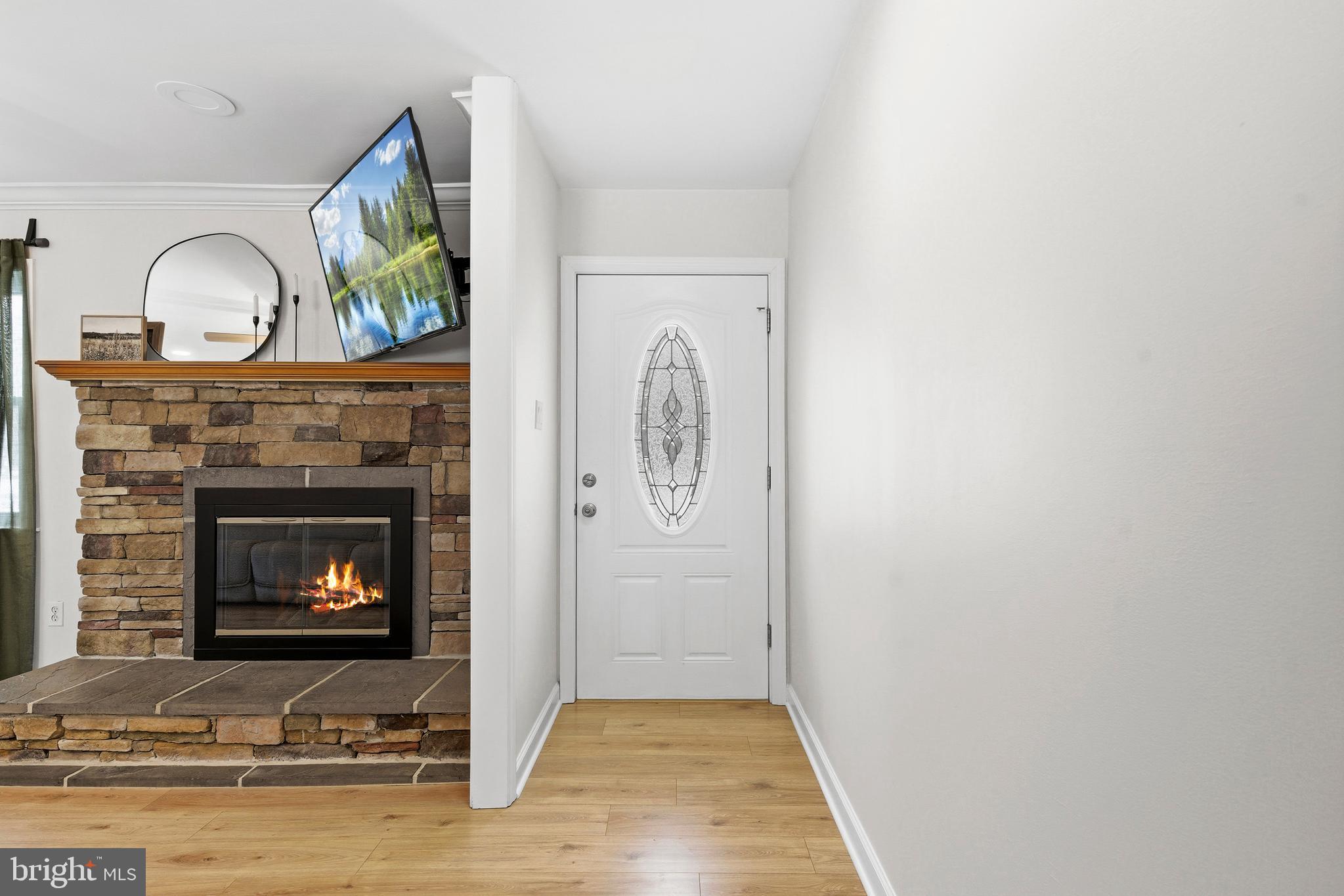 4030 Ravine Drive White Plains, MD 20695 - Photo 5 of 64 a living room with furniture and a fireplace