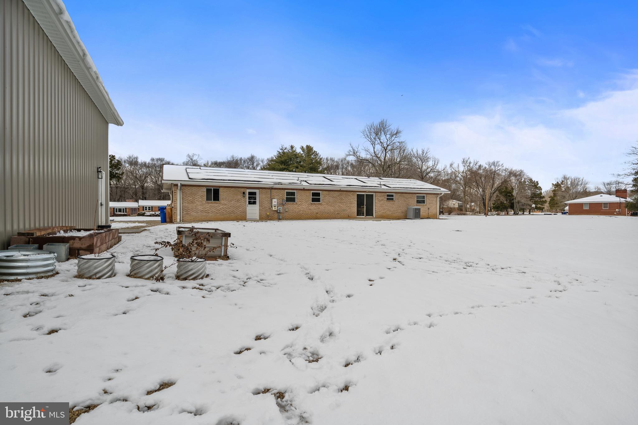4030 Ravine Drive White Plains, MD 20695 - Photo 60 of 64 a view of a dry yard with a house