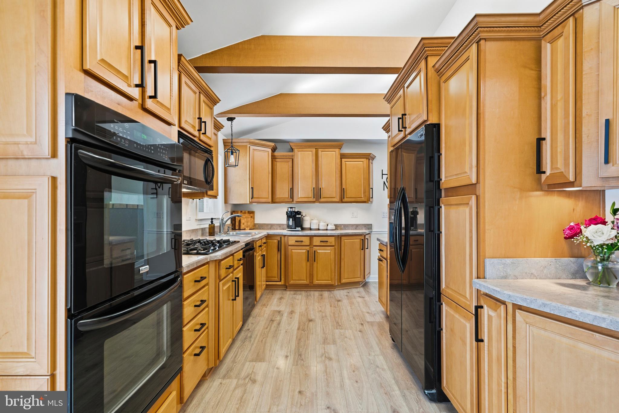 4030 Ravine Drive White Plains, MD 20695 - Photo 7 of 64 a kitchen with stainless steel appliances a refrigerator and a stove