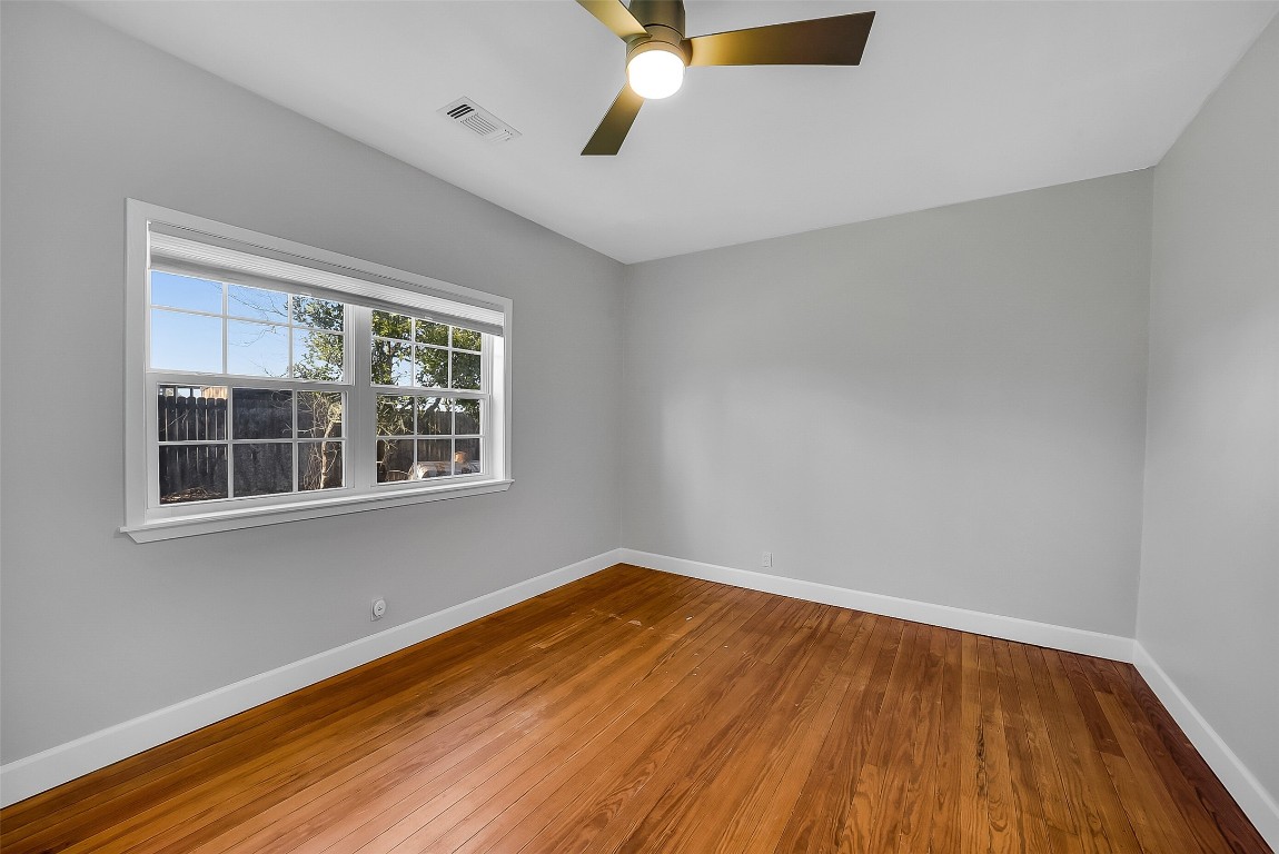 1005 Church Street Brenham, TX 77833 - Photo 28 of 44 a view of empty room with wooden floor and fan