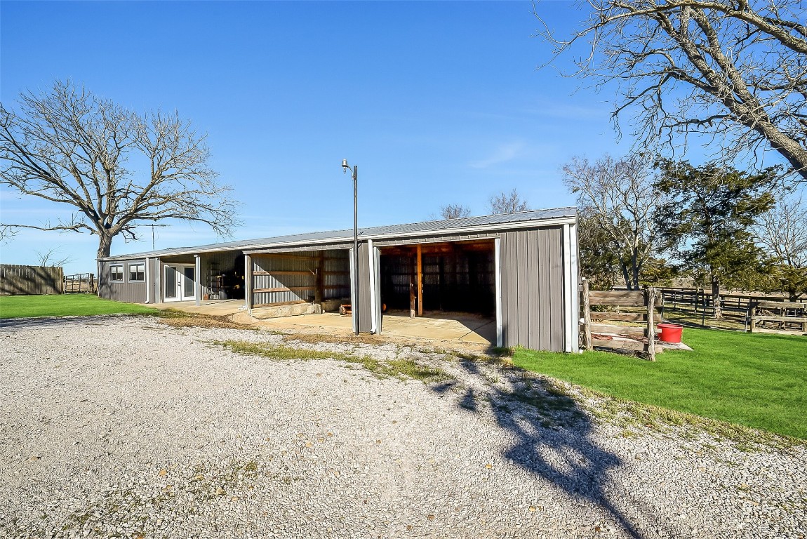 1005 Church Street Brenham, TX 77833 - Photo 33 of 44 a view of a house with a yard and large tree