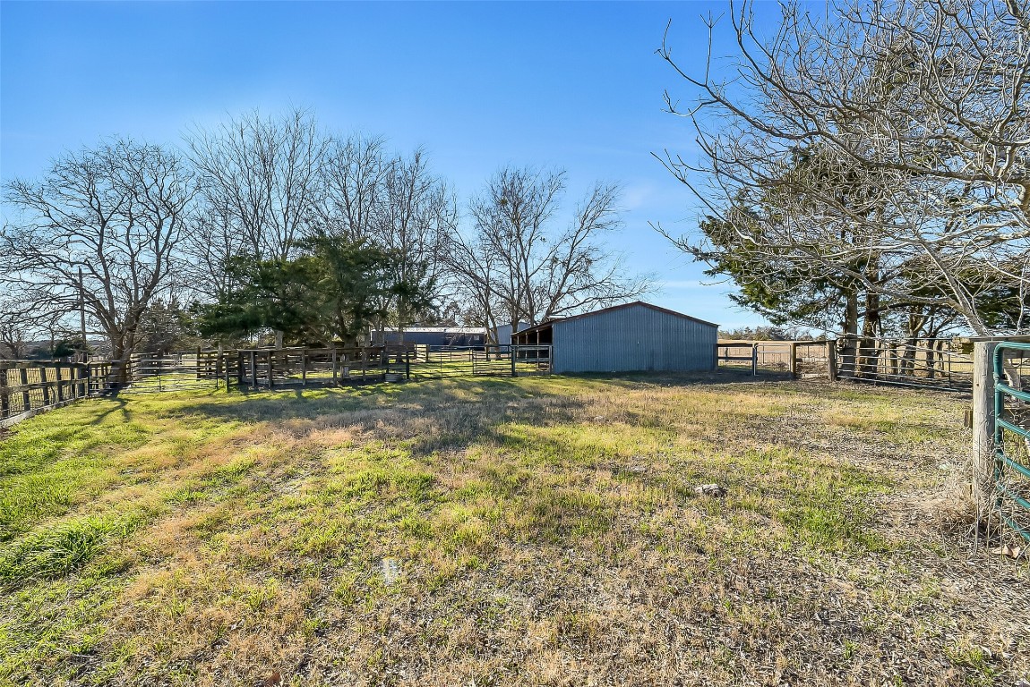 1005 Church Street Brenham, TX 77833 - Photo 41 of 44 a front view of a house with a yard