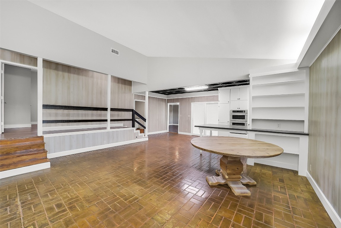 1005 Church Street Brenham, TX 77833 - Photo 9 of 44 a view of a room with shelves and wooden floor