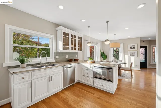 a view of a sink a window and a mirror
