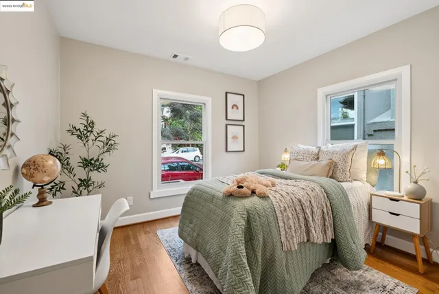 a bedroom with a bed and a table in it