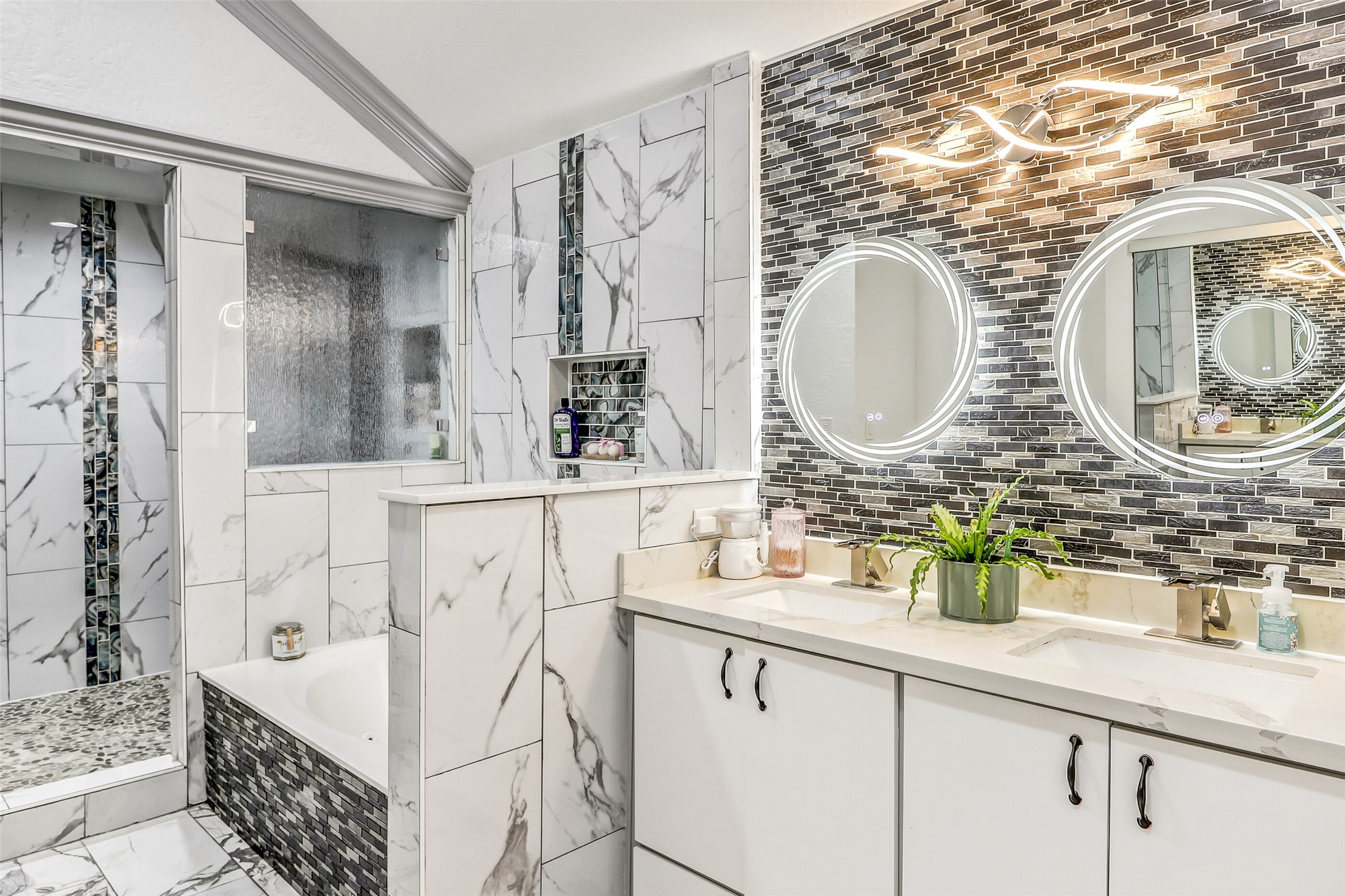 15922 Riverside Grove Drive Houston, TX 77083 - Photo 13 of 23 a bathroom with a sink and a mirror