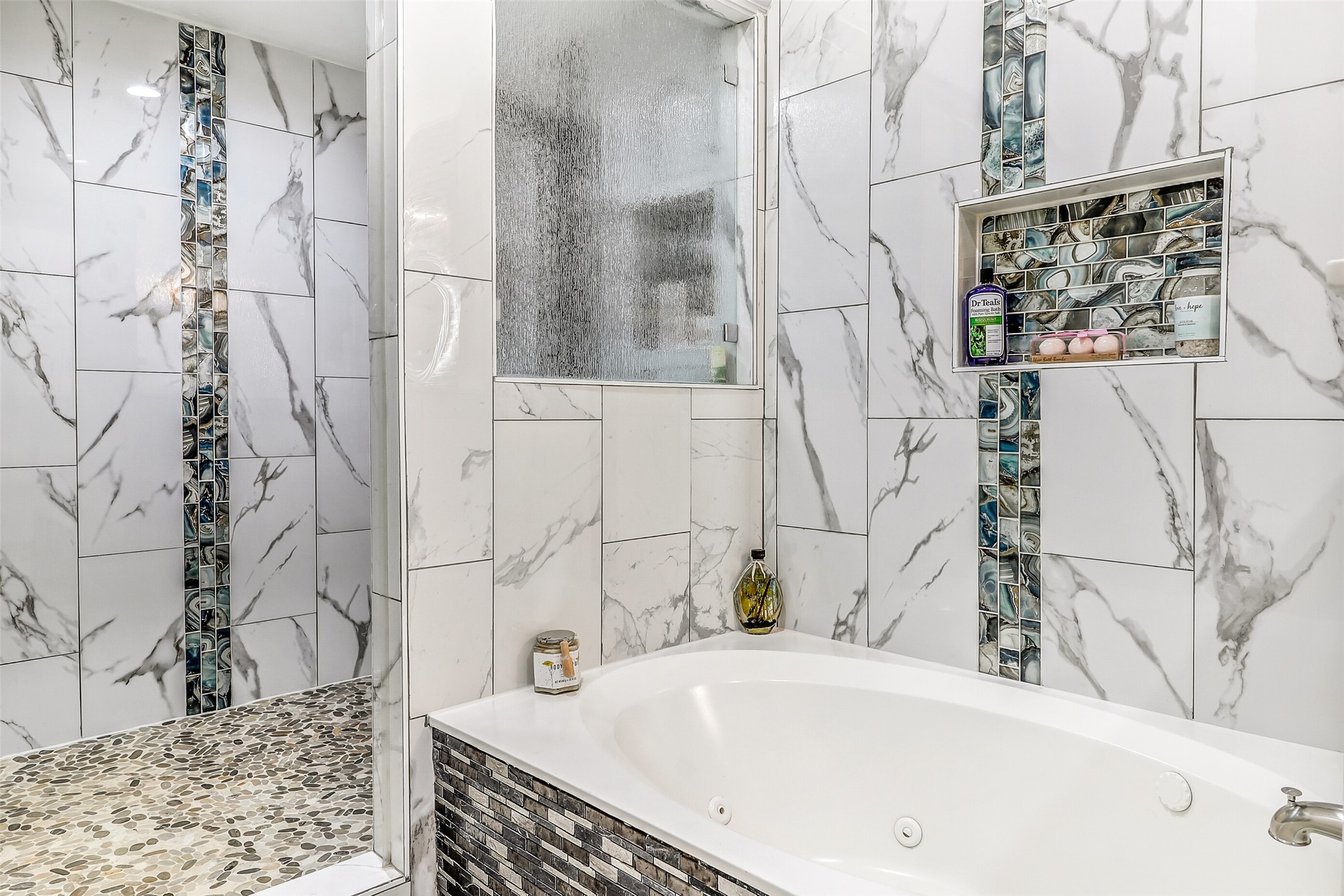 15922 Riverside Grove Drive Houston, TX 77083 - Photo 14 of 23 a bathroom with a bathtub and shower