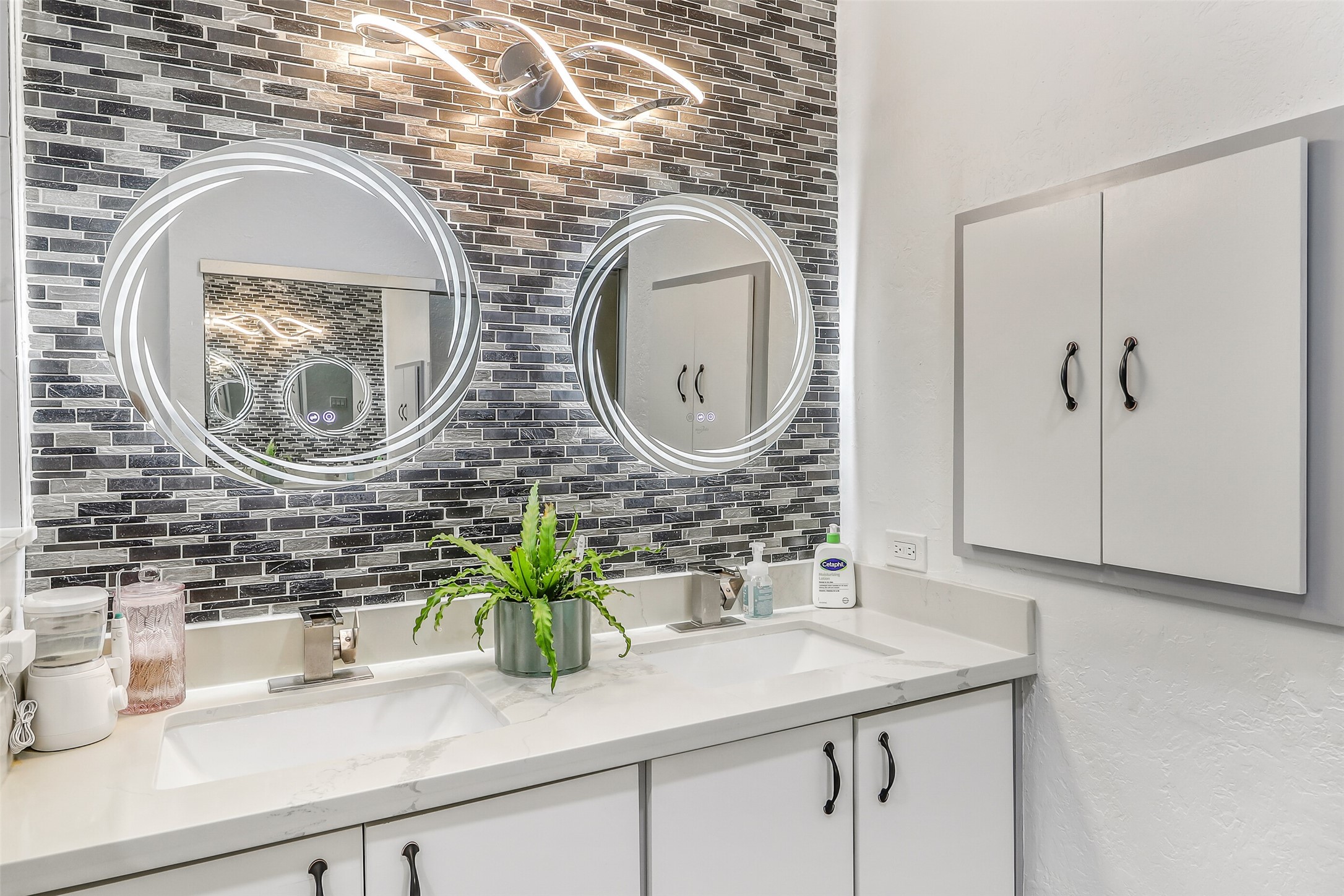 15922 Riverside Grove Drive Houston, TX 77083 - Photo 16 of 23 a bathroom with a sink and a mirror