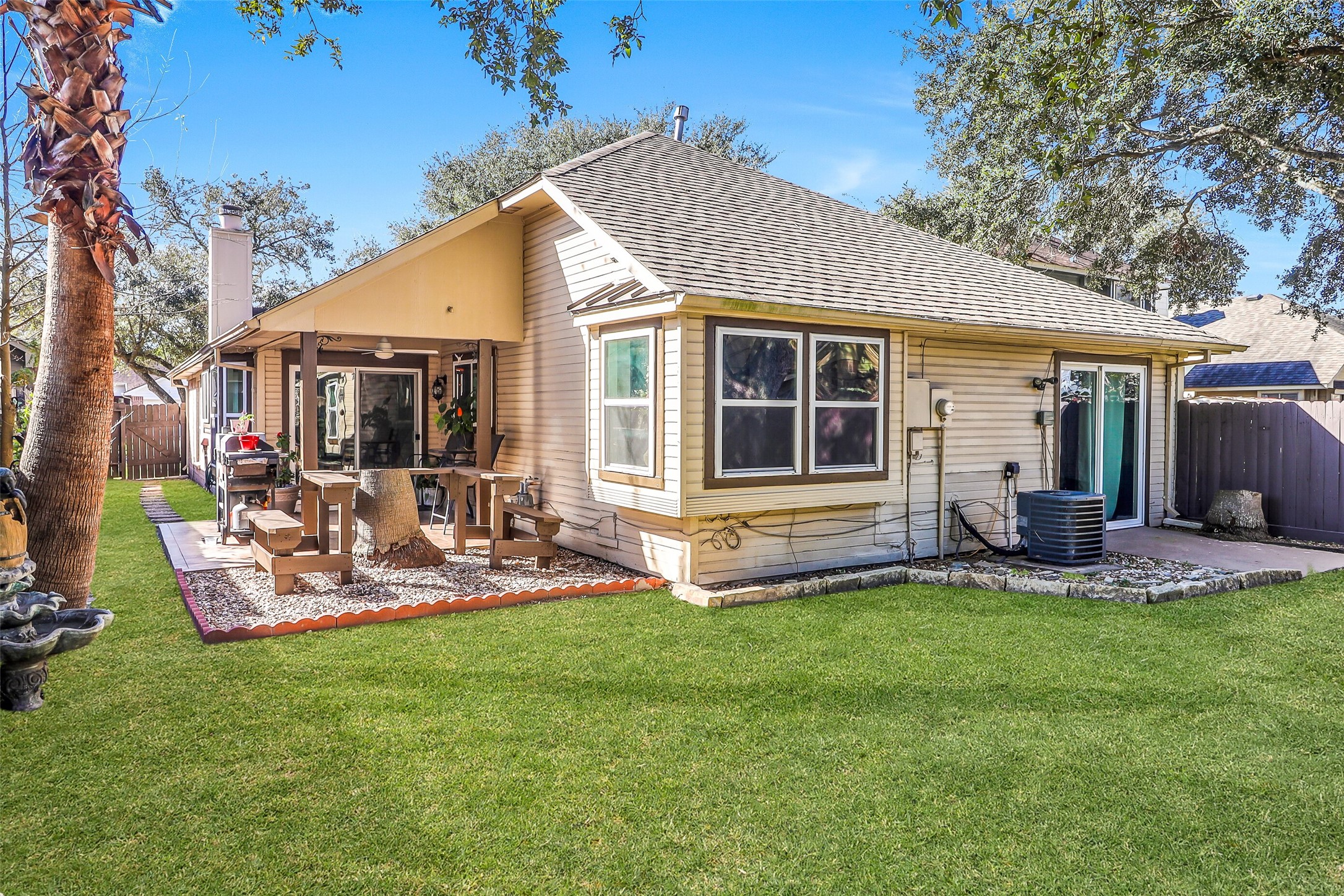 15922 Riverside Grove Drive Houston, TX 77083 - Photo 19 of 23 a view of a house with backyard and porch