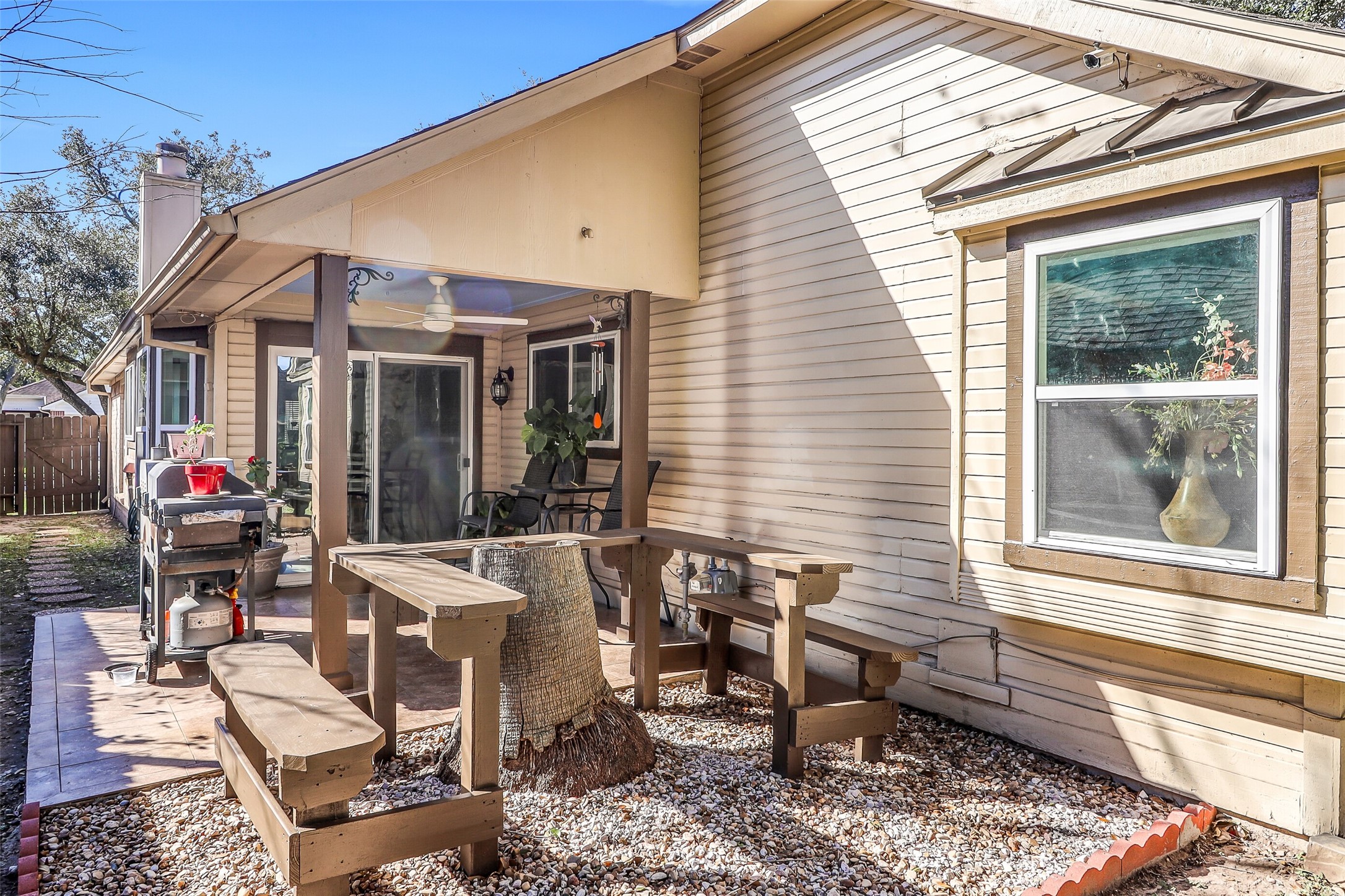 15922 Riverside Grove Drive Houston, TX 77083 - Photo 20 of 23 a view of a patio with couple of chairs and potted plants