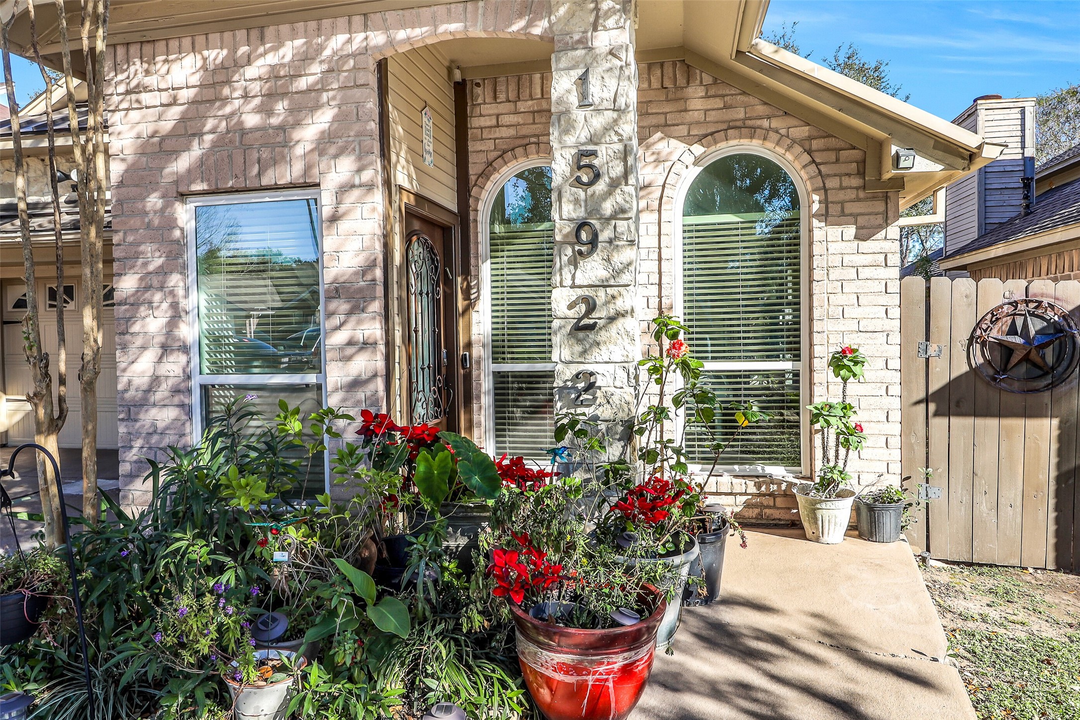 15922 Riverside Grove Drive Houston, TX 77083 - Photo 2 of 23 a front view of a house having outdoor seating