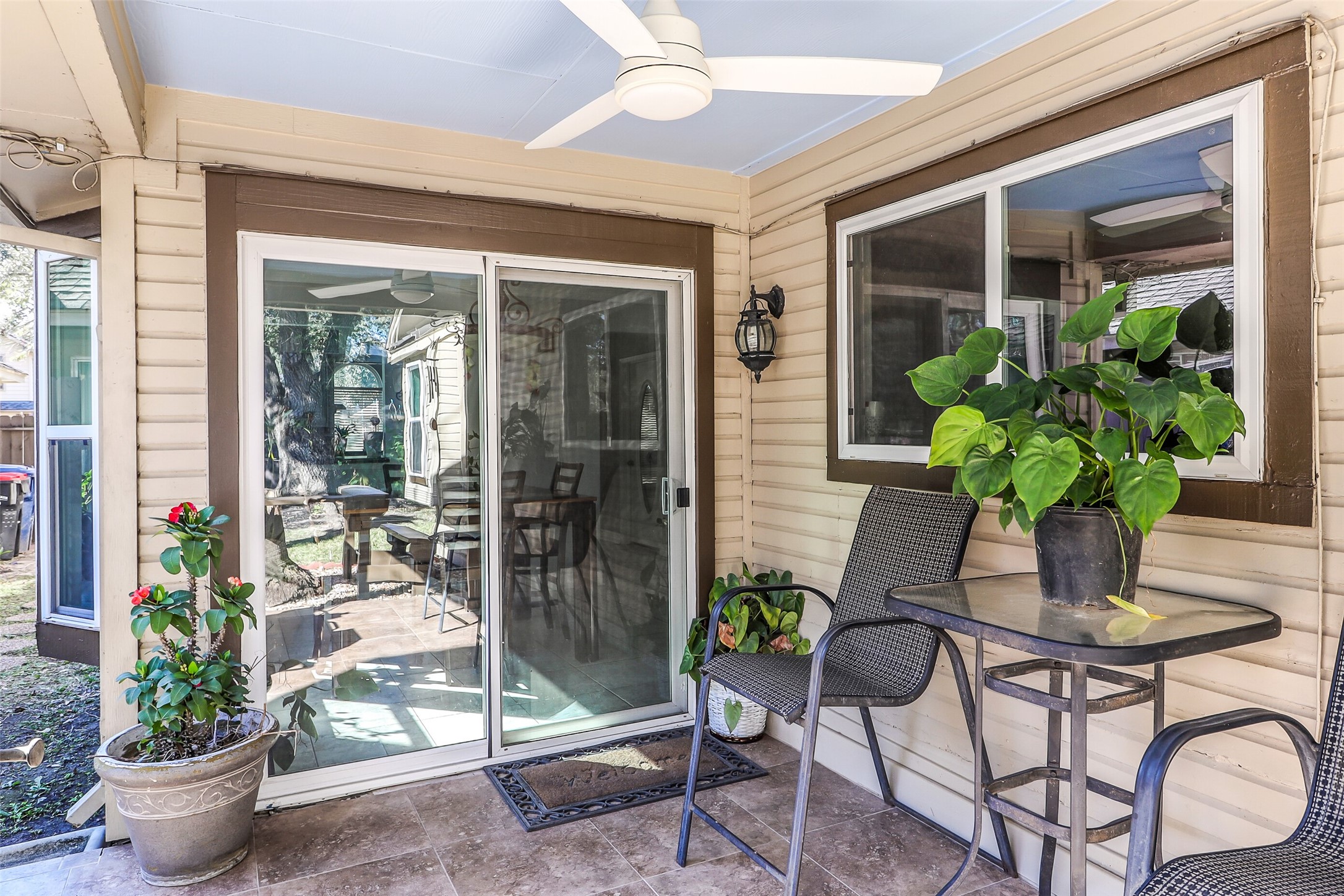 15922 Riverside Grove Drive Houston, TX 77083 - Photo 21 of 23 a dining room filled with furniture and potted plants