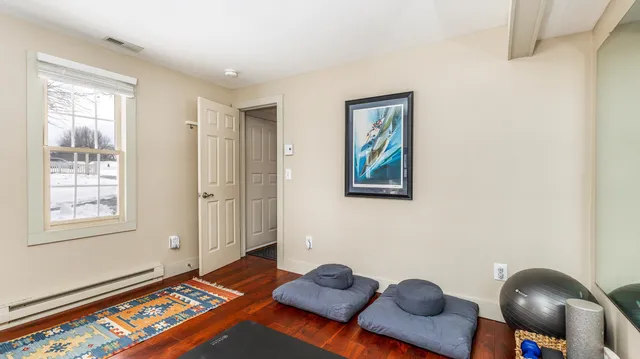 a room with window and mirror