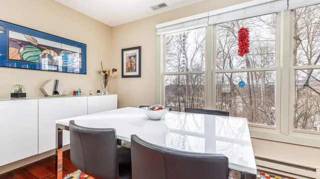 a dining room with large window