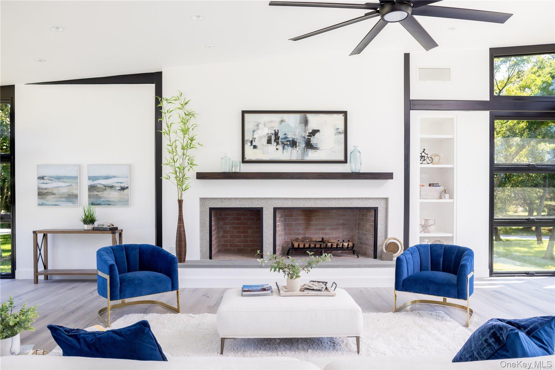 290 Windward Road Orient, NY 11957 - Photo 11 of 31 a living room with furniture and a fireplace