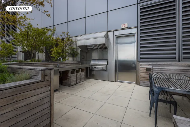 a kitchen with kitchen island a counter and a refrigerator