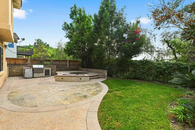 a view of a backyard with sitting area