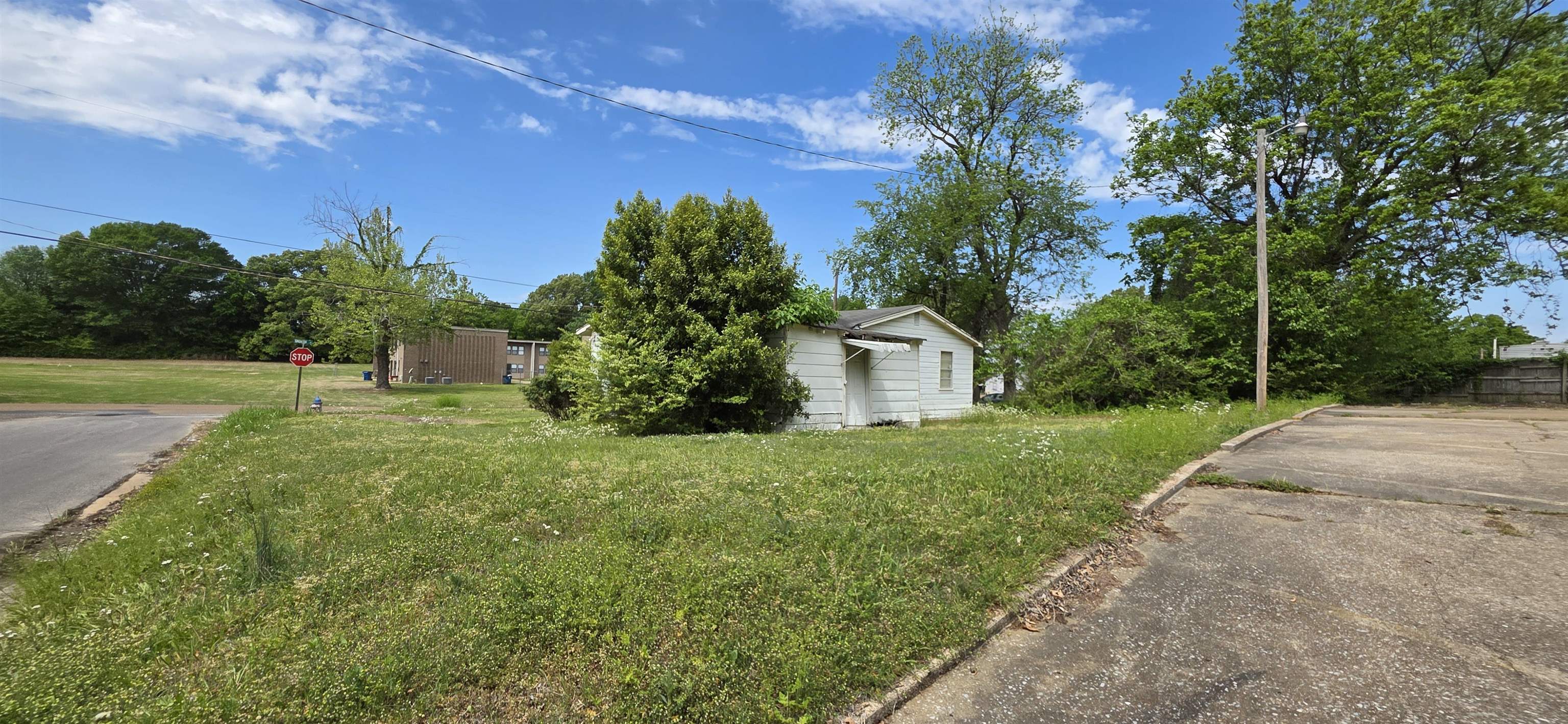 604 Simonton Street Covington, TN 38019 - Photo 4 of 5 Single-story structure with white siding and a covered entry