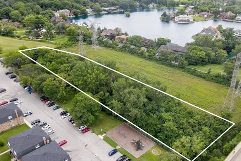 a view of a lake with a house in the background