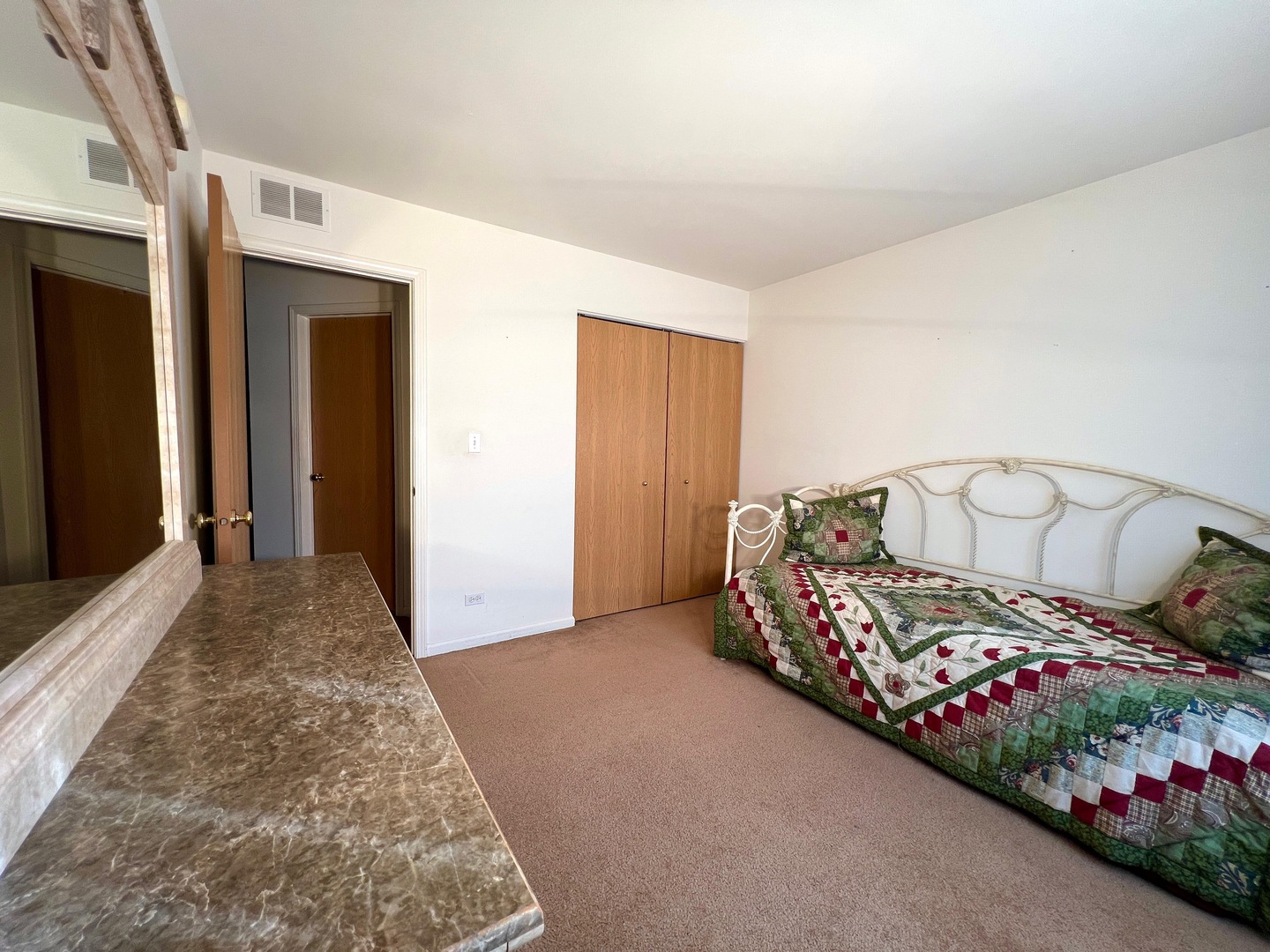 752 South Parkside Drive Round Lake, IL 60073 - Photo 12 of 38 a bedroom with furniture and flowers