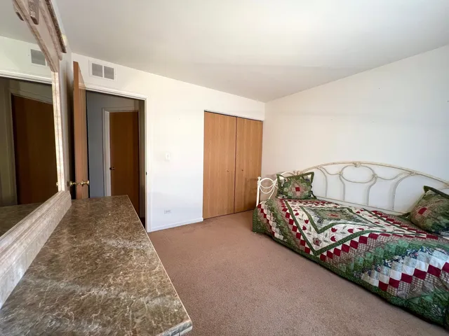 a view of a hallway with stairs
