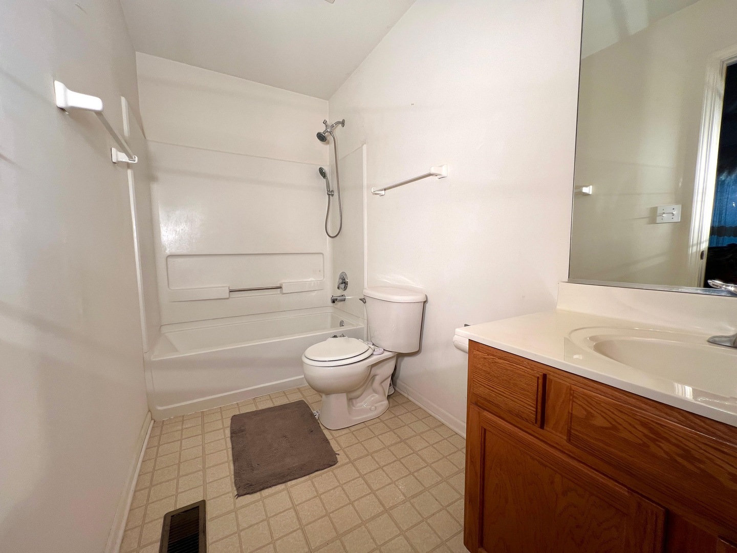 752 South Parkside Drive Round Lake, IL 60073 - Photo 16 of 38 a bathroom with a toilet a sink and shower