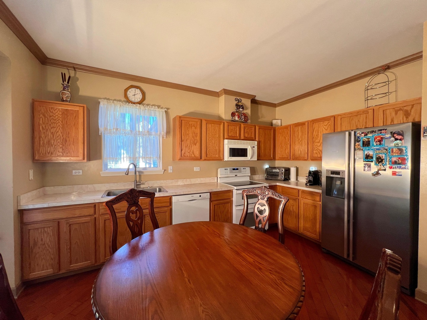 752 South Parkside Drive Round Lake, IL 60073 - Photo 26 of 38 a kitchen with stainless steel appliances a sink cabinets and wooden floor