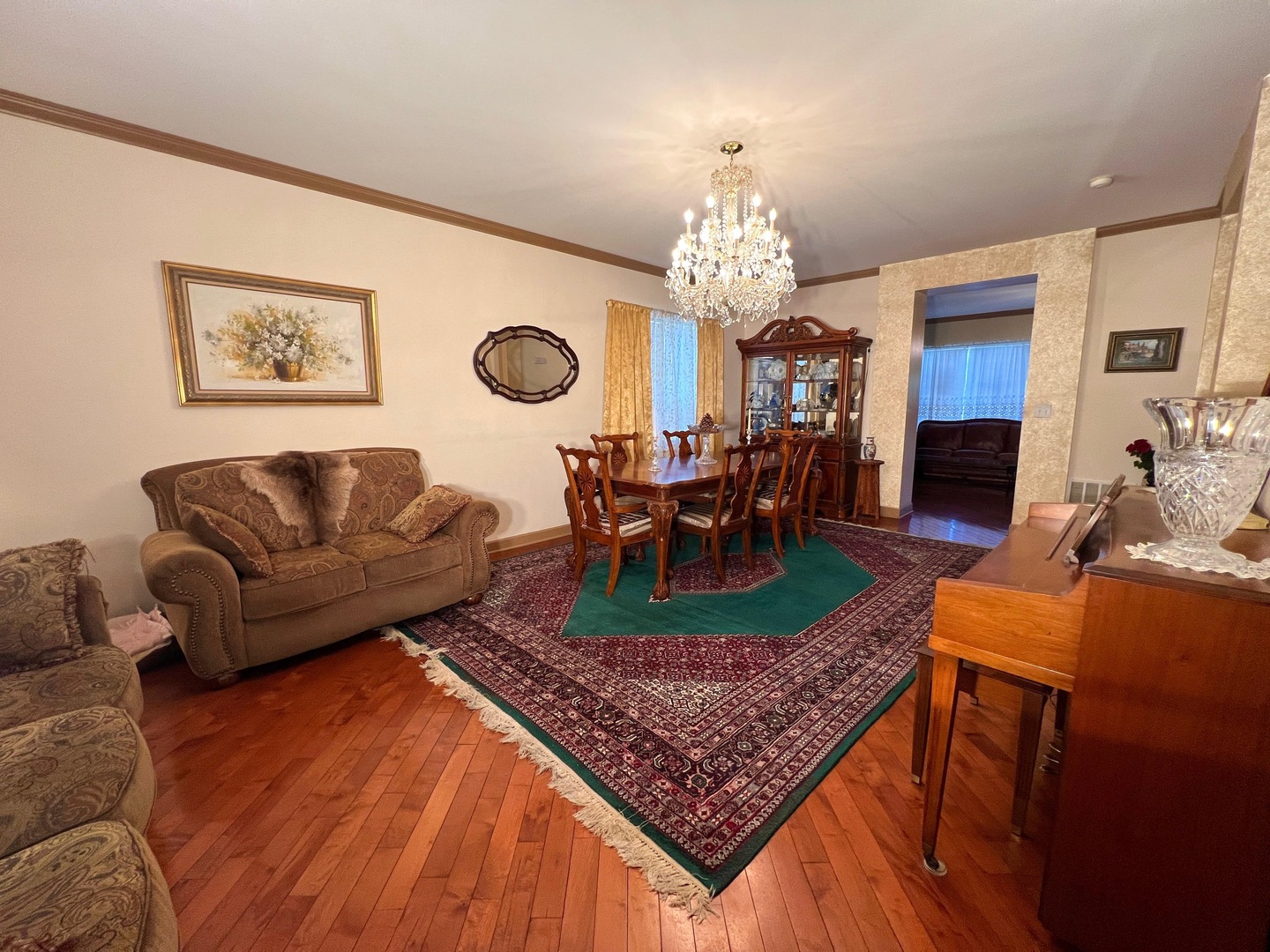 752 South Parkside Drive Round Lake, IL 60073 - Photo 8 of 38 a living room with furniture a chandelier and a rug
