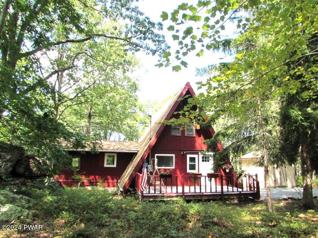 807 Rimrock Court Hawley, PA 18428 - Photo 1 of 41 a view of a house with a big yard plants and large trees